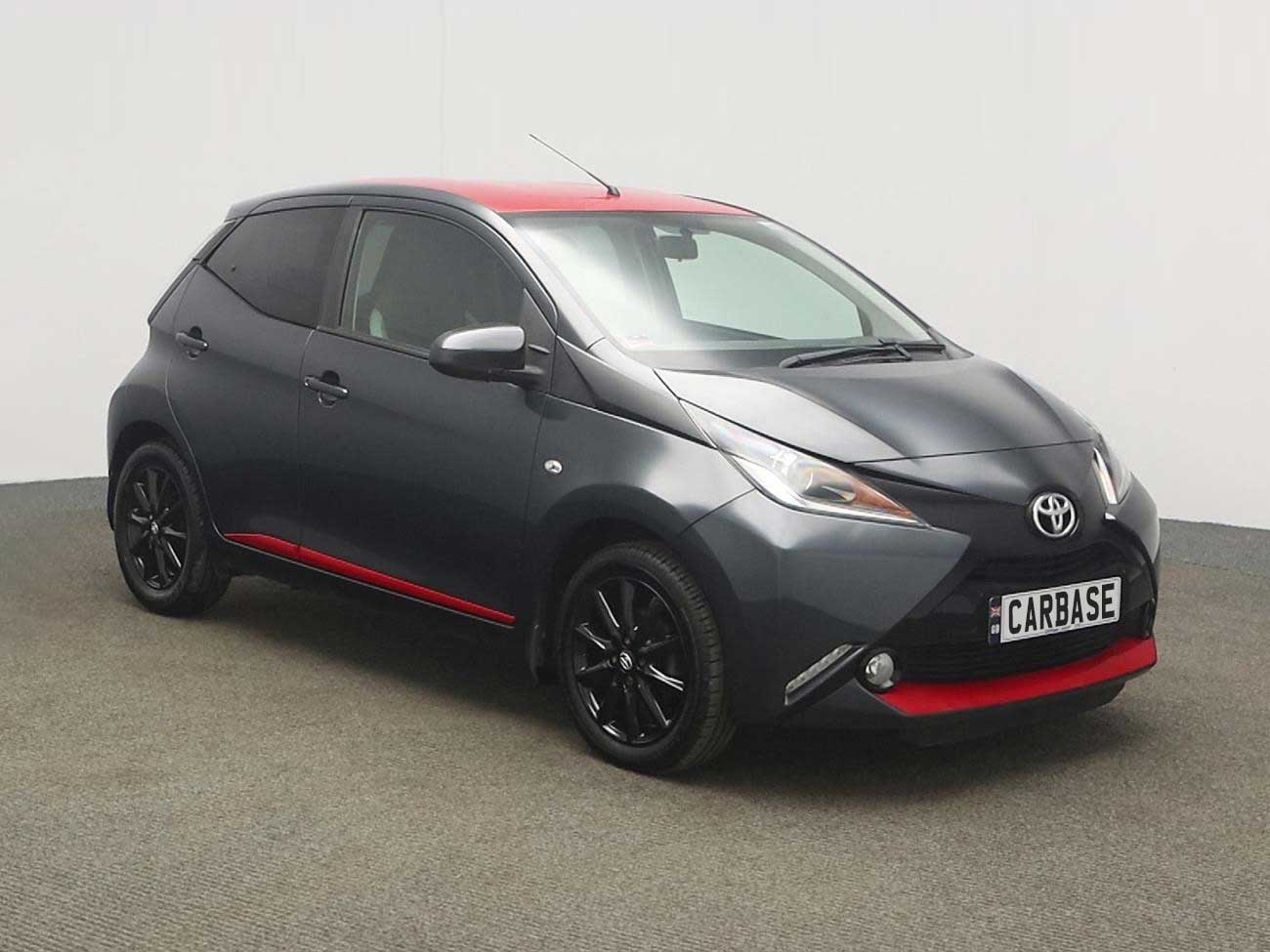 Side view of Toyota Aygo in showroom
