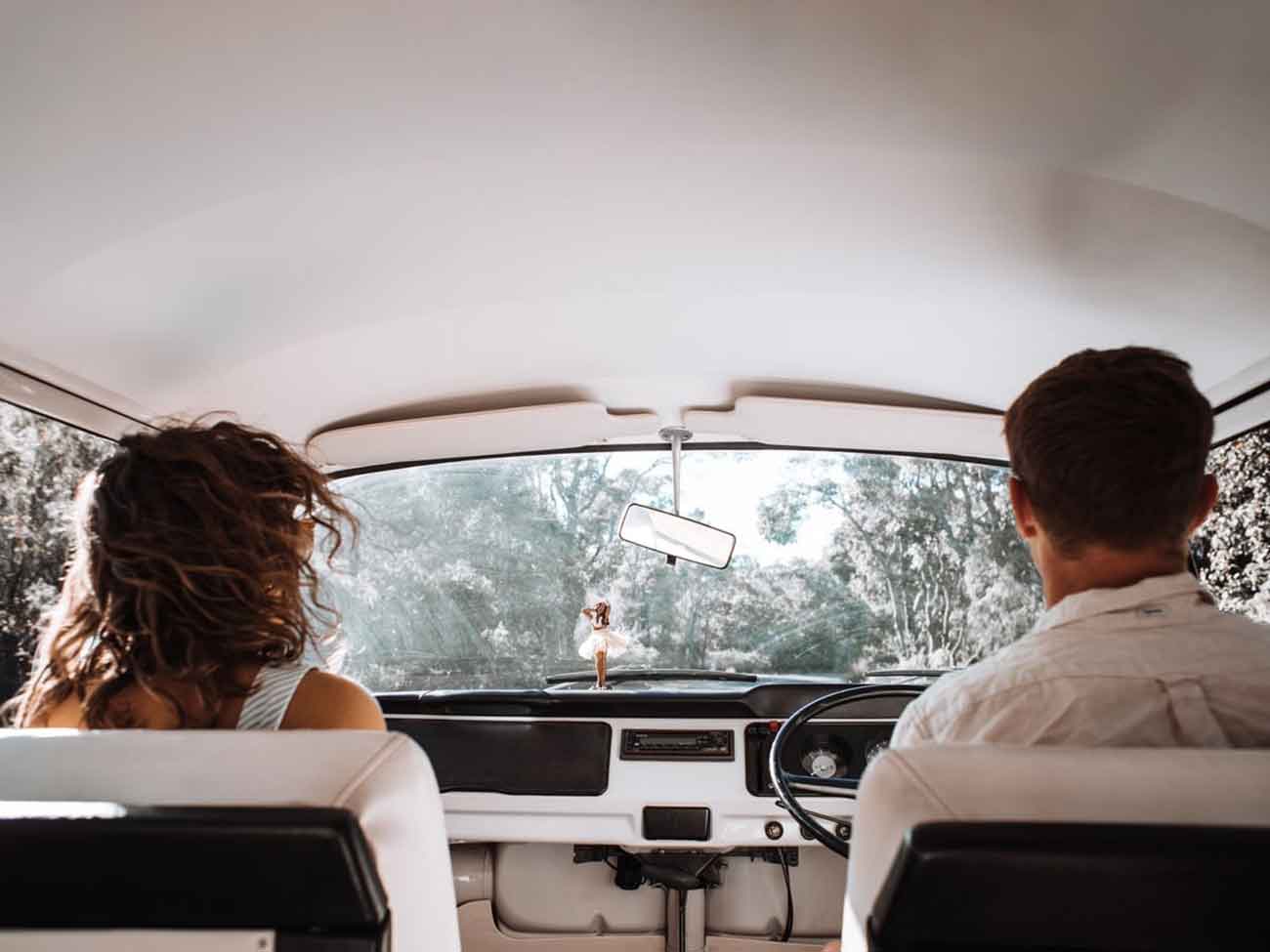 Couple in front seats of a car
