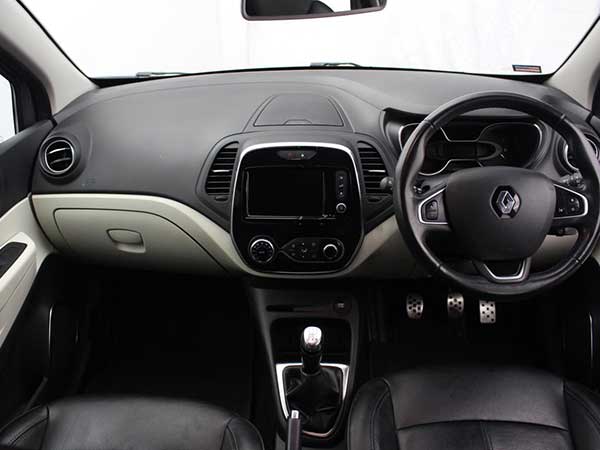 Internal dashboard view of Renault Captur SUV in showroom