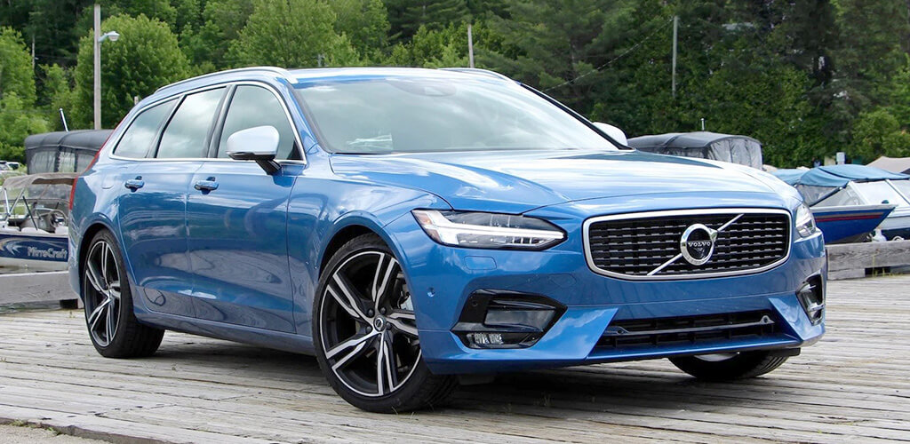 Side view of blue Volvo V90 T8