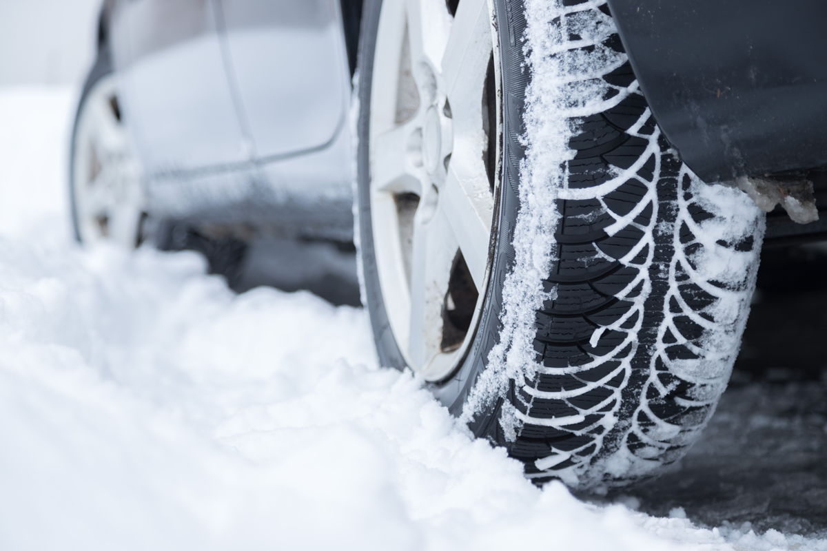 Snow covered car tyres