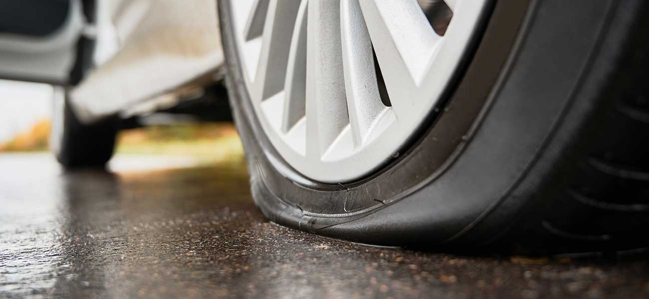 Flat tyre on car