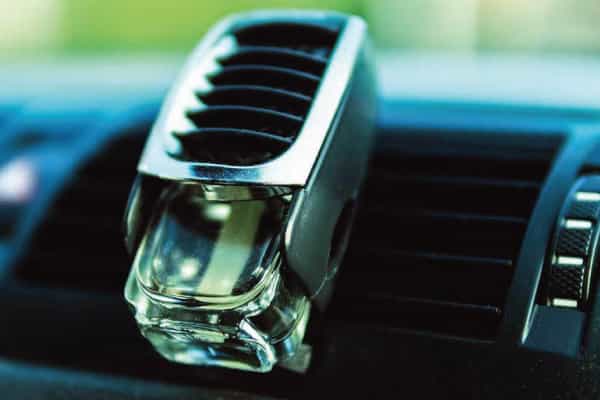 Car air freshener mounted in car fan 