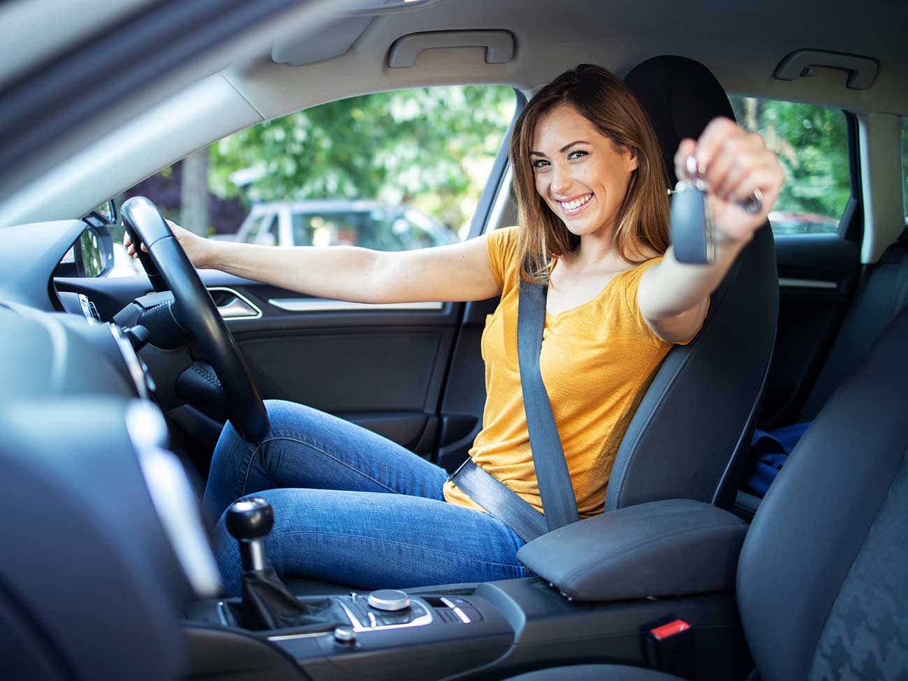 Picture of woman with car keys smiling