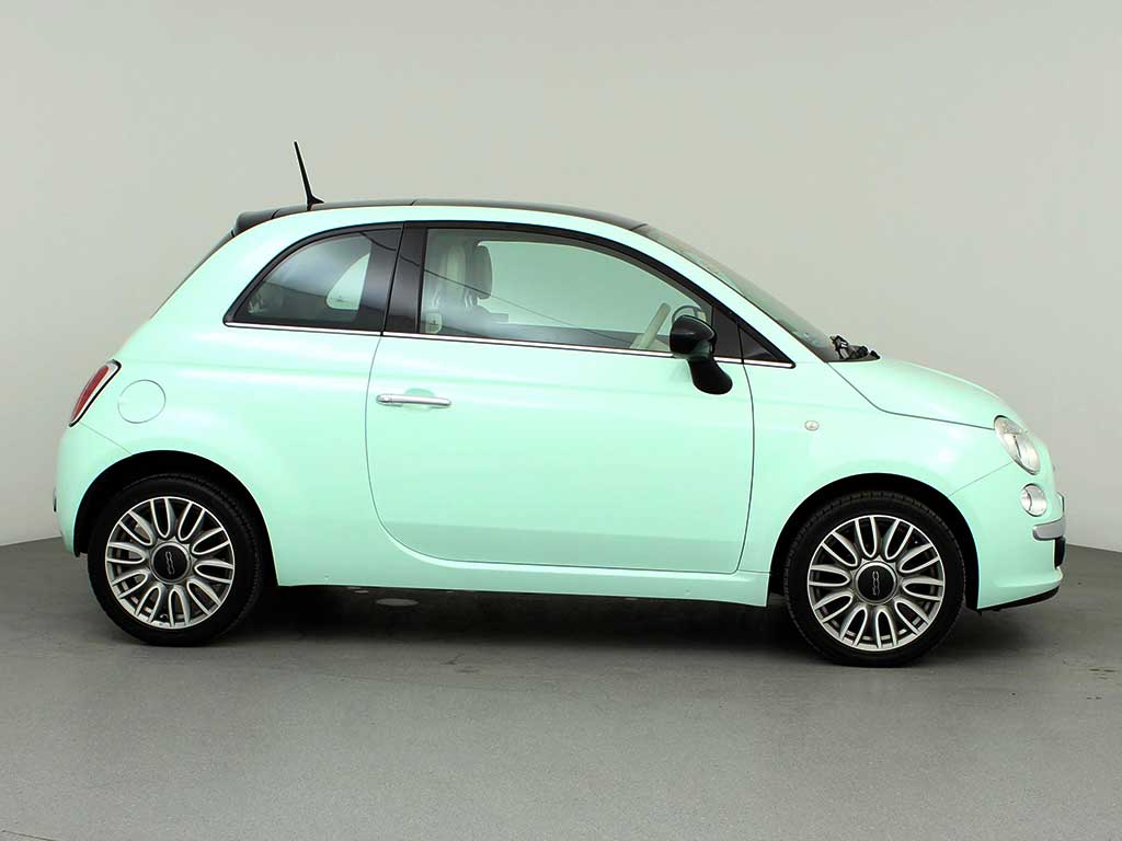 Side view of Fiat 500 in pastel green