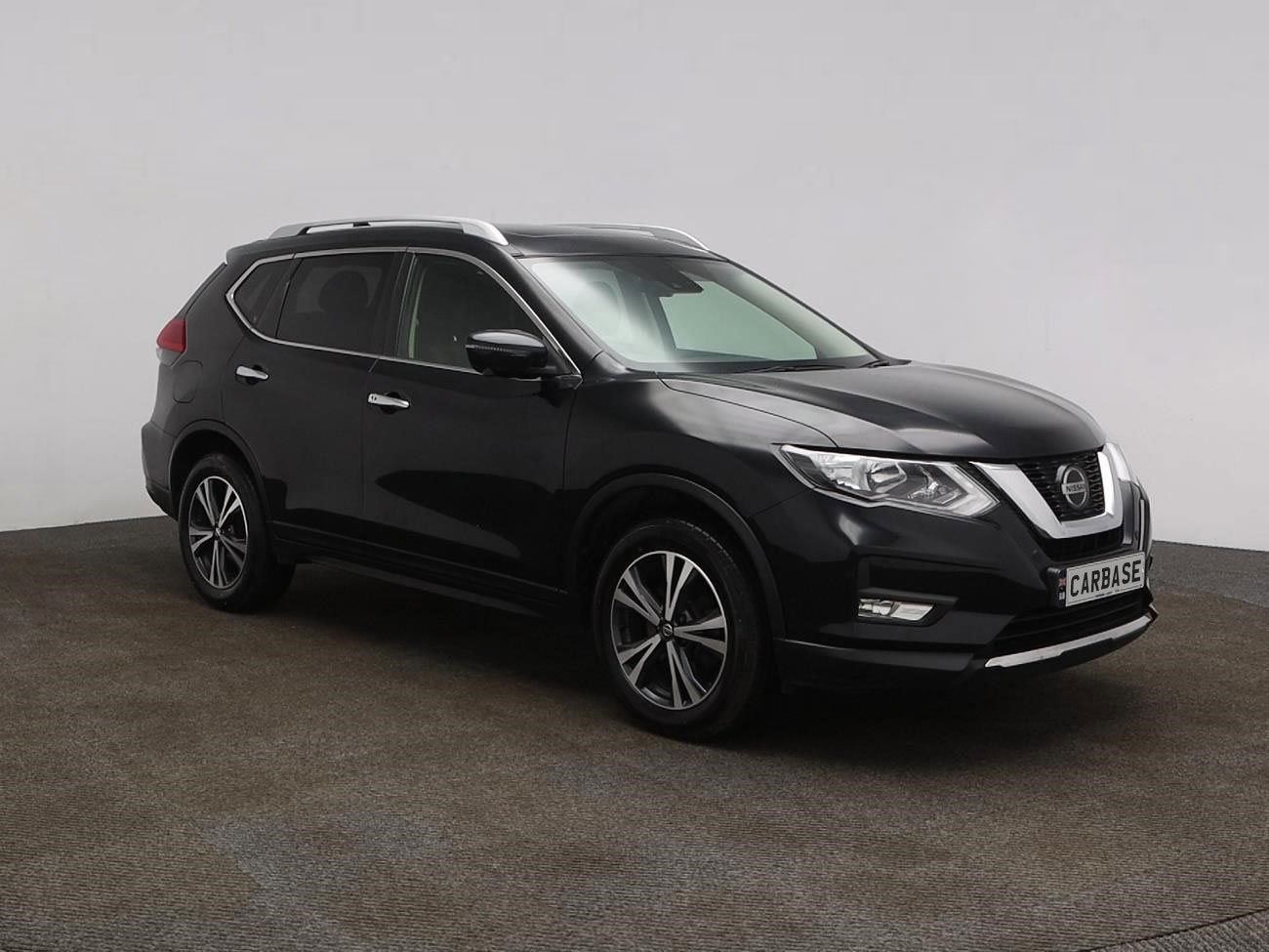 Side view of Nissan X-Trail in showroom